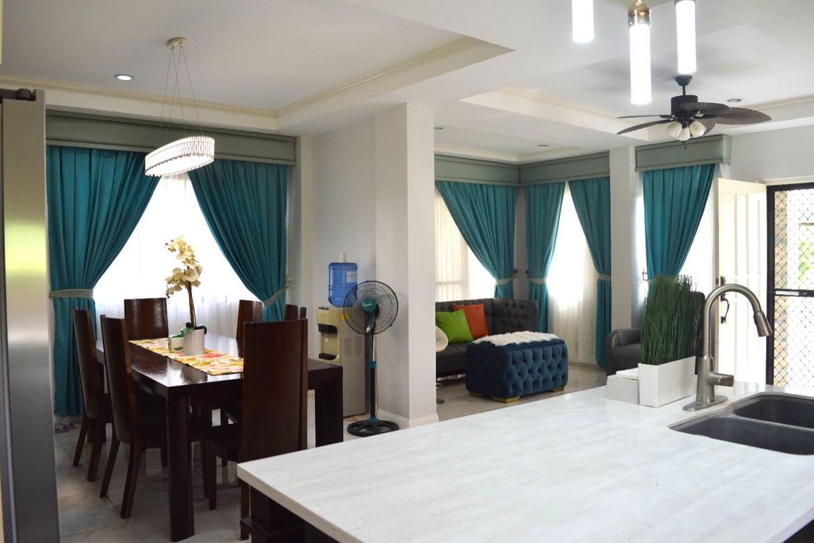 House with Beautiful Landscaped Garden in a beachfront community in